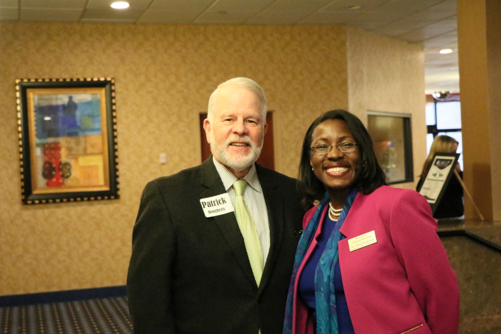 Patrick Dougherty, member of Missourians to End Poverty, poses with keynote Dr. Tiffany Anderson. 